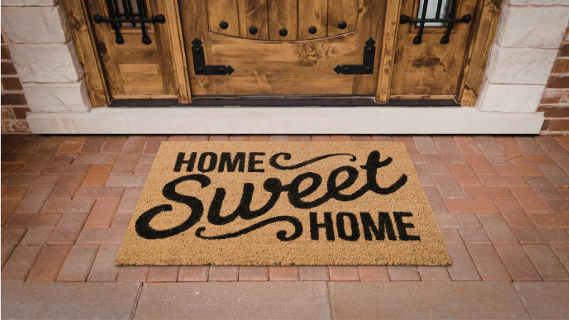 Welcome mat at the front door of a house